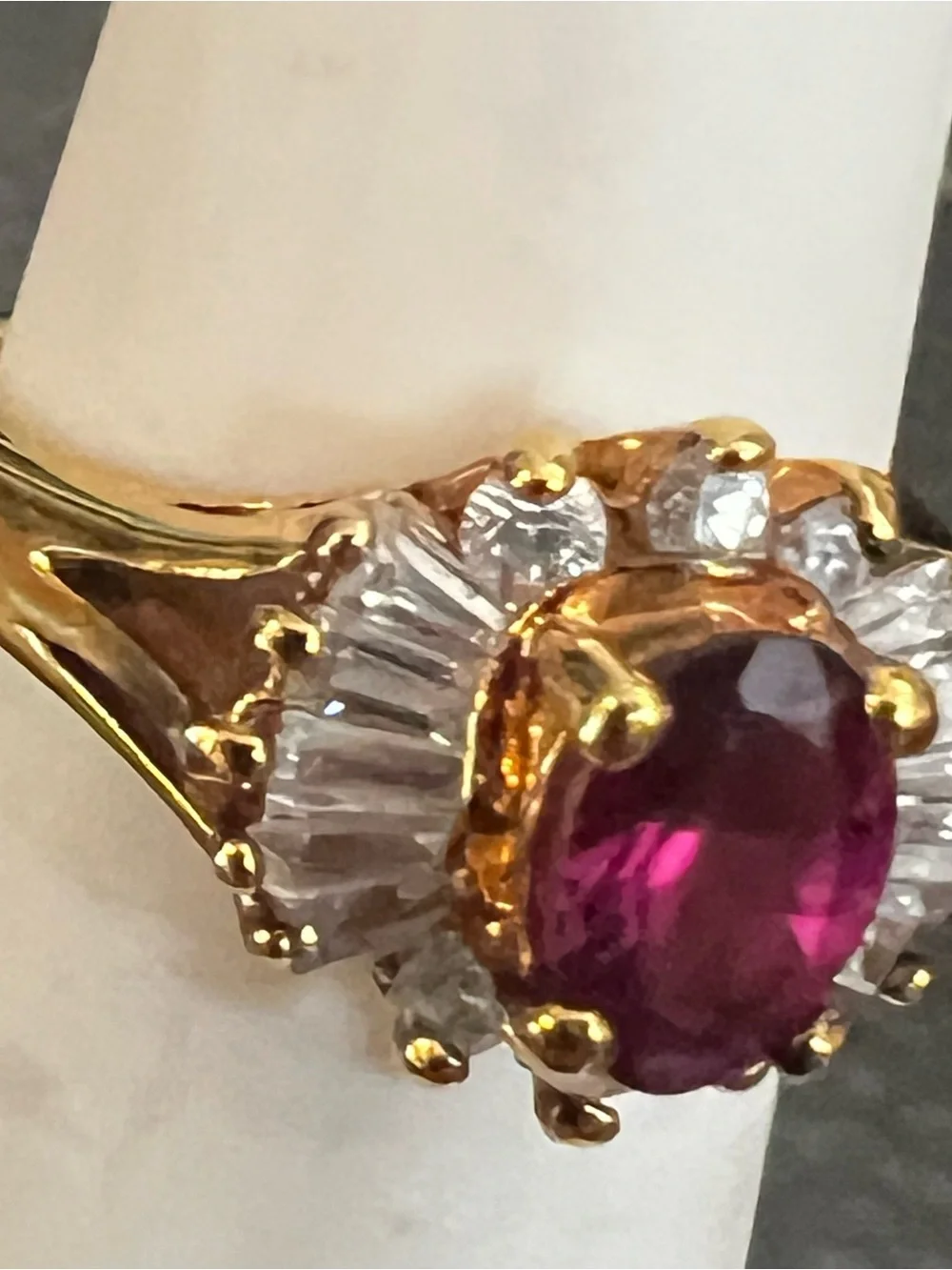Gold Ring with Ruby-Red Center and Clear Accent Stones